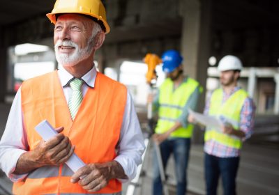 Construction engineer with foreman worker checking construction site Construction engineer with foreman worker checking construction site